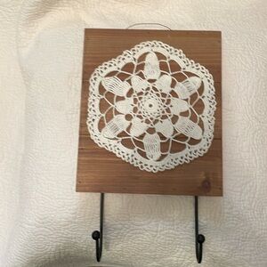 Hand crafted wall hook. Wood, 2 metal hooks with vintage crocheted doily.